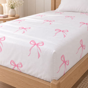 Close-up of pink bow 100% cotton single fitted sheet with a deep, fully elasticated mattress corner