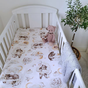 Introducing our Baby Fitted Sheet, fully elasticated for a snug and secure fit. Featuring a delightful "Lovely Woodland Animals" design with teddy bears, squirrels, and leaves, in a charming palette of brown.
