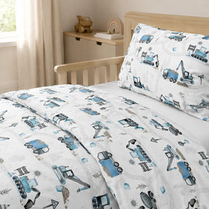 Close-up of blue digger and construction vehicle bedding in 100% OEKO-TEX® cotton, made in the UK. Fabricco