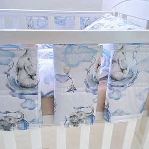 Boys’ safari nursery bedding set with blue elephant and rainbow print, including cot protector wraps