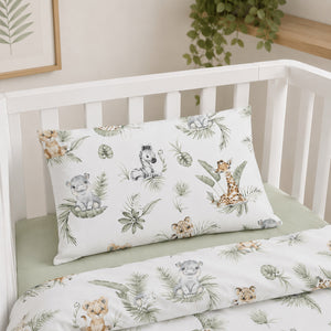 Close up of cotton safari baby bedding set showing matching pillowcase and duvet cover with giraffe, elephant, zebra and tiger jungle animal pattern.