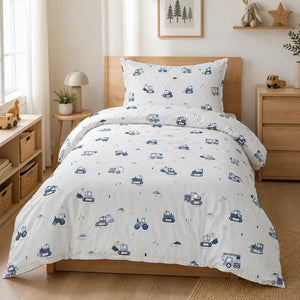 Boys’ blue and white construction vehicles single bedding set with diggers, tractors and trucks on a UK single bed.