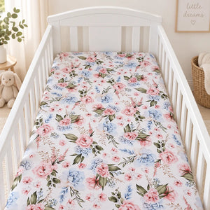 English Garden Flowers baby cot fitted sheet with pink and blue floral print in a white nursery cot