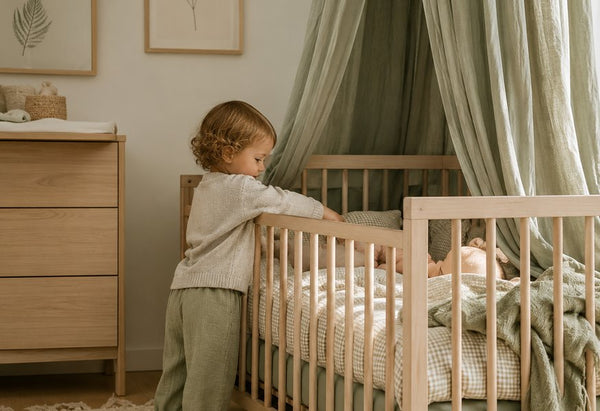 Fabricco baby bedding in a soft sage green nursery, handmade in the UK