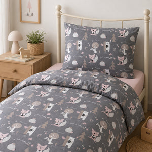 Girls’ woodland single bedding set with matching pillowcase and soft blush pink fitted sheet on a single bed.