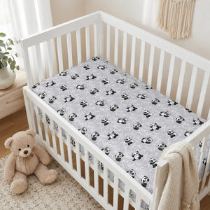Grey panda baby fitted sheet in 100% cotton on a white cot, available in cot, cot bed and crib sizes UK