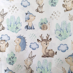Close-up of Hedgehog and Forest Friends 100% cotton fabric from Fabricco UK with hedgehogs and woodland animals for children’s sewing and crafts.