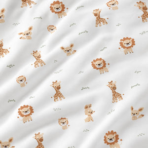White cotton fabric draped over an oak rail, with small beige and brown lions, giraffes and woodland animals