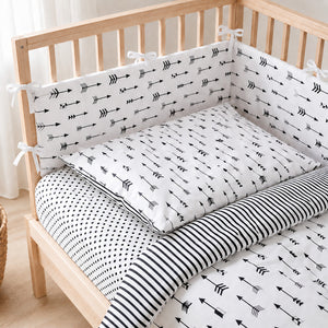 Monochrome arrows cot bedding set with decorative bumper on 60 x 120 cm wooden cot