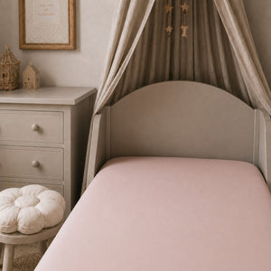 Plain blush pink single fitted sheet on a UK single bed, made from 100% OEKO-TEX cotton by Fabricco UK.