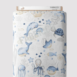 Sea Life cotton fabric by the metre from Fabricco UK with ocean animals in mint green and blue for nursery sewing.