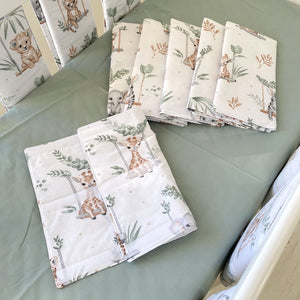 Sage green cot bed wraps with jungle animal prints, made from soft cotton with adjustable Velcro fastenings for a secure and breathable fit.