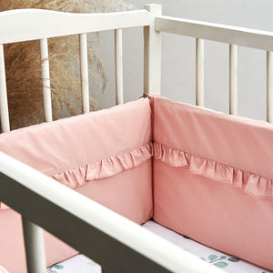 Decorative pink cot bumper with ties – safe and stylish baby bedding accessory