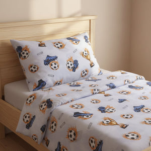 Children's bed with soccer-themed bedding and pillowcase on a wooden bed frame.