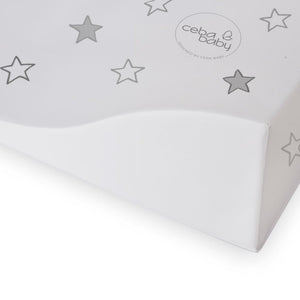 Close-up of the padded raised side and grey star print on a white wipe-clean baby changing mat.
