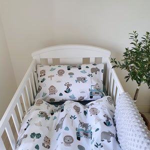 Transform your baby’s cot into a jungle adventure with our Sage Safari Adventure bedding set. Featuring cheerful elephants, playful monkeys, and a safari jeep, all in calming sage green, grey, and a hint of black, this set is perfect for little explorers.  Made from soft, pure cotton, both the duvet cover and pillowcase showcase the fun safari theme on both sides. It’s a wonderful way to make your baby’s sleep space both cosy and exciting.