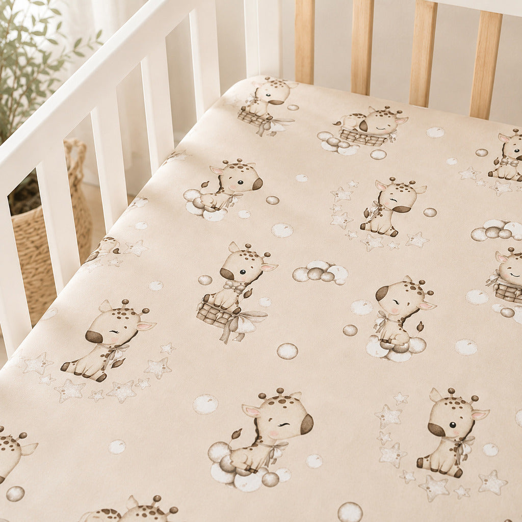 Beige giraffe baby fitted sheet in 100% cotton on a cot mattress with stars and bubbles, available in cot, cot bed and crib sizes