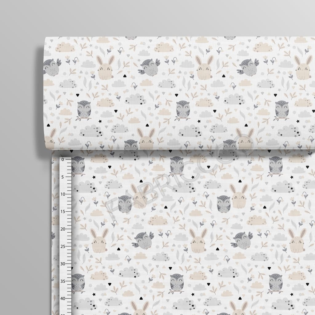 Beige Owls and Friends cotton fabric on a roll from Fabricco UK showing the upright vertical woodland animal print.