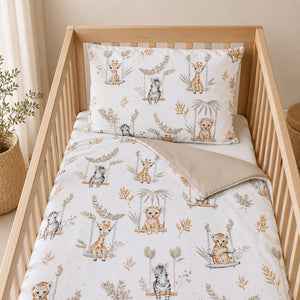Reversible beige safari cot bedding with plain beige reverse