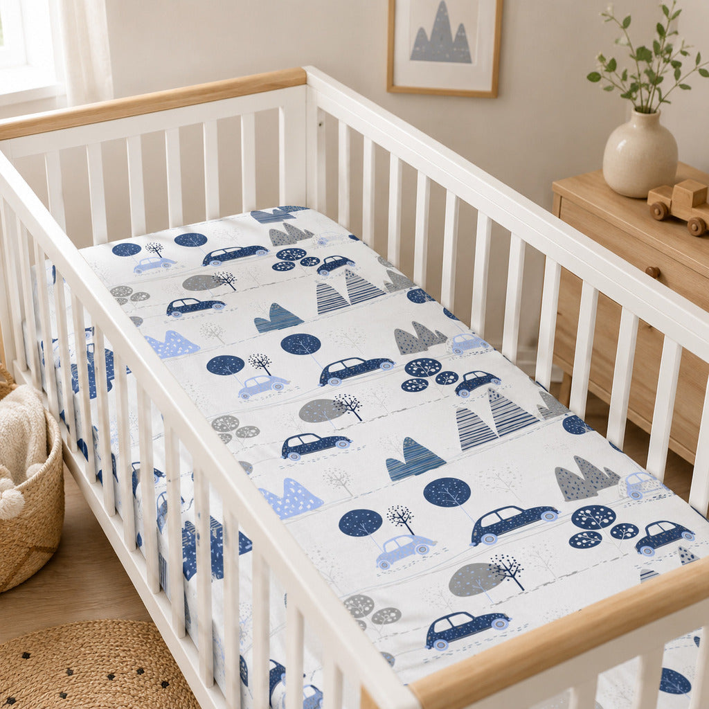 Blue cars baby fitted sheet in a Scandinavian cot nursery, 100% cotton fitted sheet for cot and cot bed UK