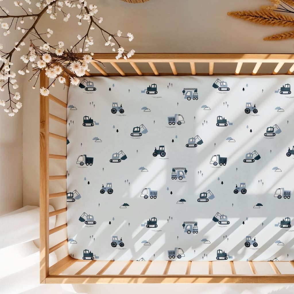 Blue construction-themed baby fitted sheet with trucks, diggers and tractors, 100% cotton soft breathable nursery bedding, elasticated cot sheet for baby crib