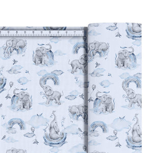 Blue elephants and rainbow cotton fabric by the metre from Fabricco UK with clouds and nursery animal print. fabric shop Ireland