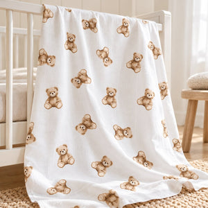 Brown teddy bear print fabric draped over a white cot in a neutral nursery , Fabricco UK