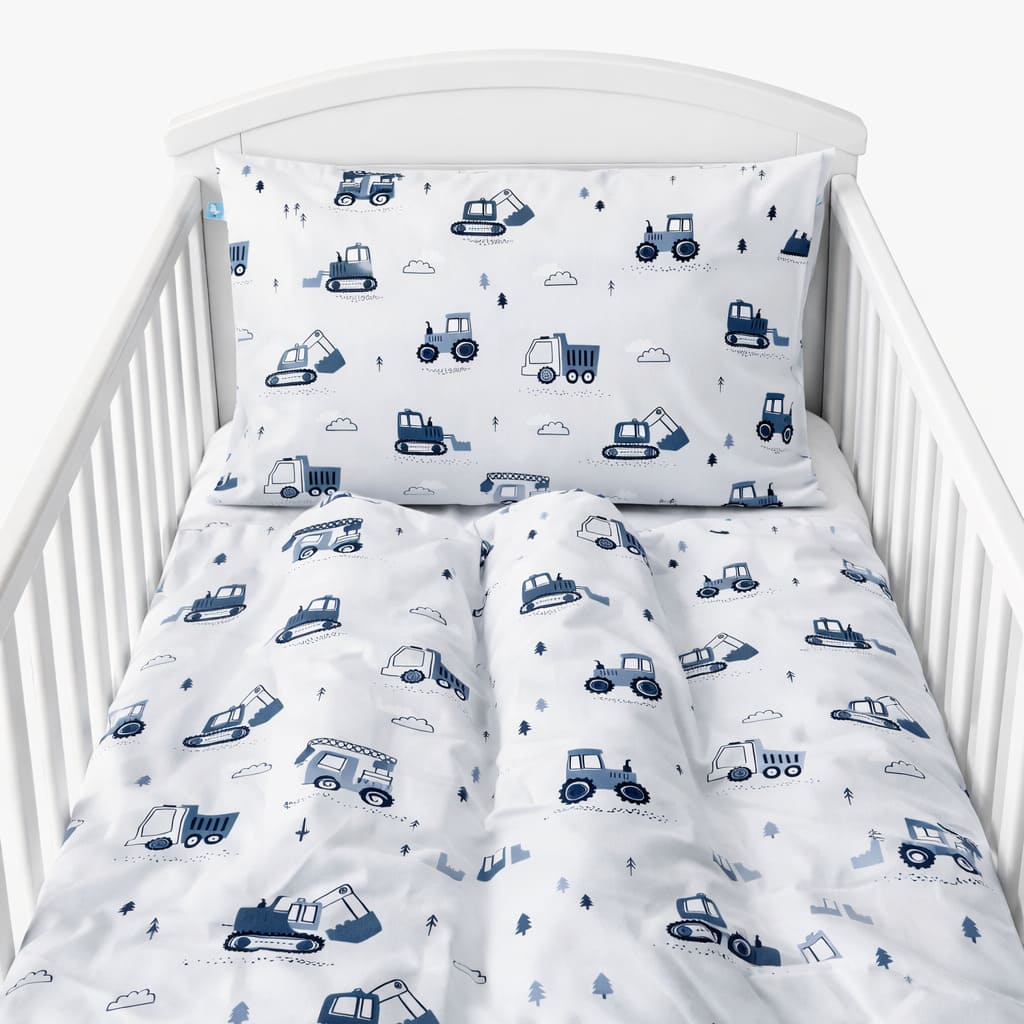 Handcrafted 100% cotton bedding set for babies and toddlers, designed to fit standard UK cots and cot beds. Soft, breathable, and gentle on delicate skin, featuring a timeless construction-themed design in calming blue and grey tones.