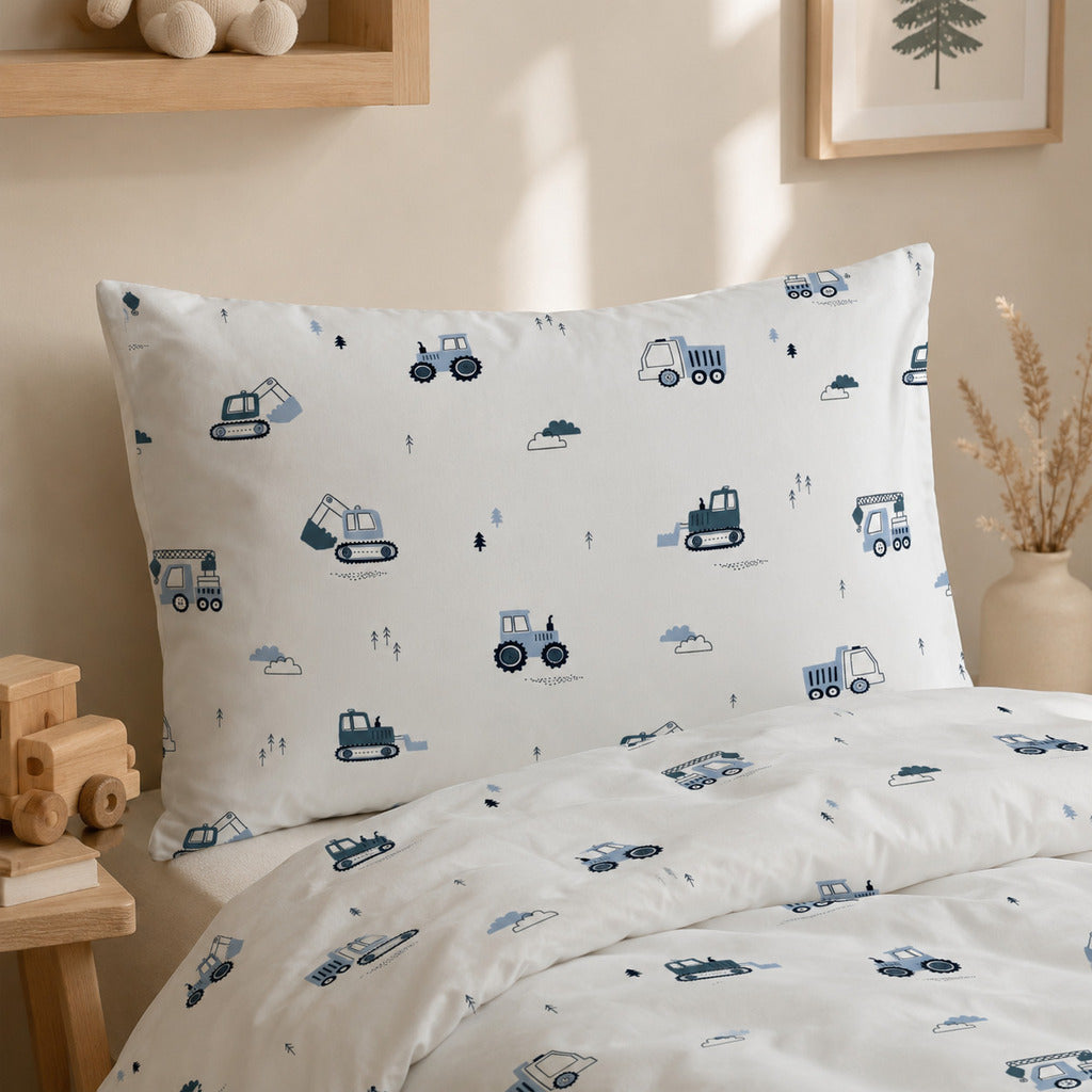 Close-up of blue construction vehicle bedding with diggers, cranes and dumper trucks in 100% OEKO-TEX® cotton. Fabricco UK
