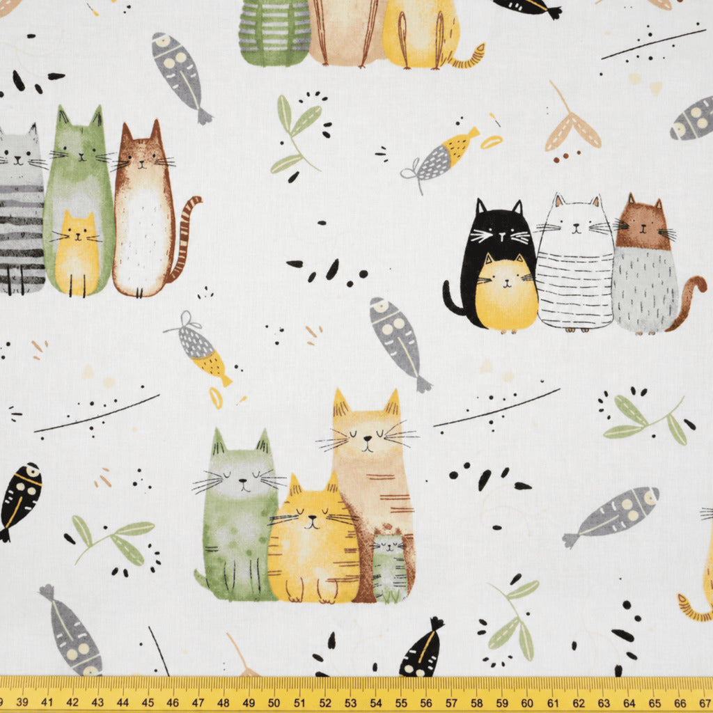 cCute cats cotton fabric with ruler showing the print scale for sewing and craft projects
 