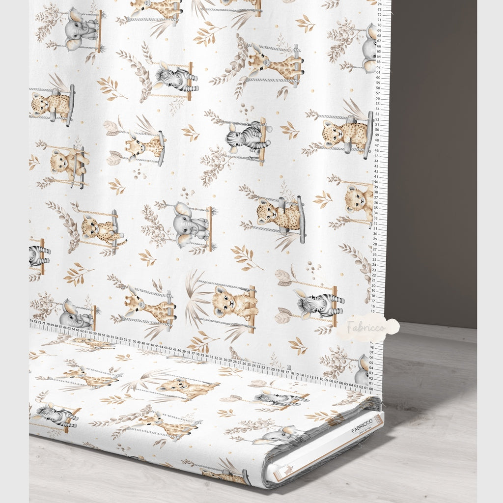 Cute Safari Animals beige cotton fabric on a roll from Fabricco UK, 160 cm wide, showing the horizontal safari animal pattern.