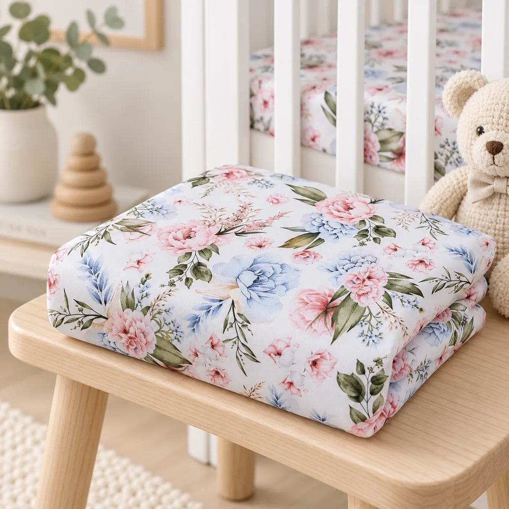 Folded English Garden Flowers baby fitted sheet in 100% cotton with pink blue and green floral design