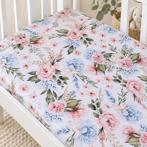 Close-up of English Garden Flowers cotton baby fitted sheet with blush pink and soft blue flowers