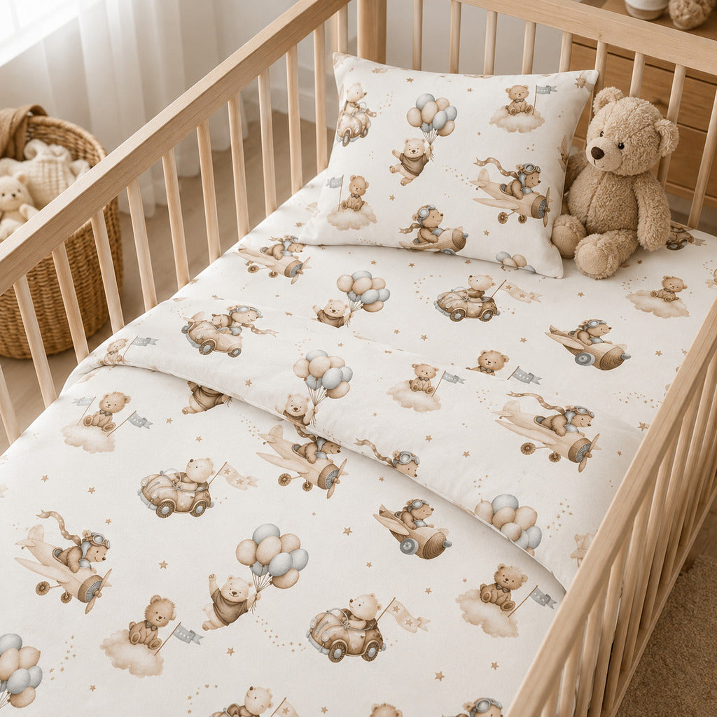 Beige teddy bear aeroplane baby bedding set in a neutral nursery