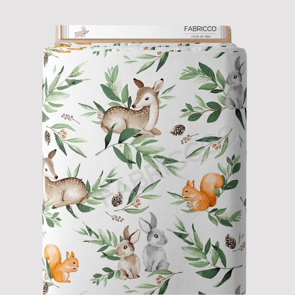 Forest Friends green cotton fabric by the metre from Fabricco UK with woodland animals in green, beige and orange for nursery sewing.