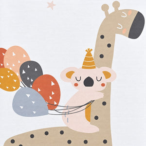 Close-up of the giraffe and koala print and wipe-clean surface on the padded baby travel changing mat.