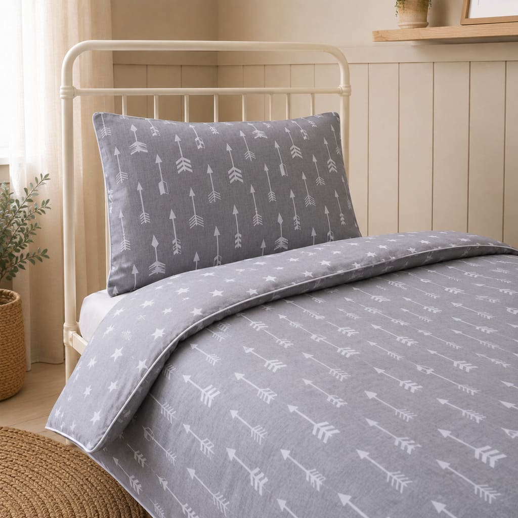 Grey and white arrows kids single bed bedding set styled in a neutral Scandinavian children's bedroom