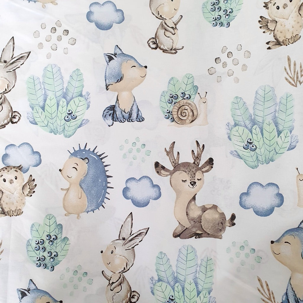 Close-up of Hedgehog and Forest Friends 100% cotton fabric from Fabricco UK with hedgehogs and woodland animals for children’s sewing and crafts.