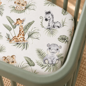 Close-up of the Jungle Animals cotton fitted sheet, showing watercolour giraffes, zebras and hippos among sage green leaves.
