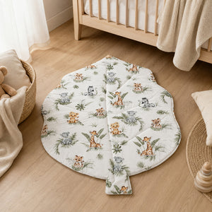 Jungle animals baby play mat in neutral Scandinavian nursery beside wooden cot, Fabricco UK
