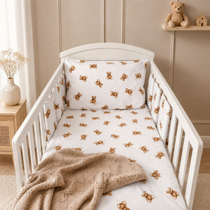 Little brown teddy bear cot bedding set with six individual padded cot wraps styled in a white cot with beige Scandinavian nursery decor