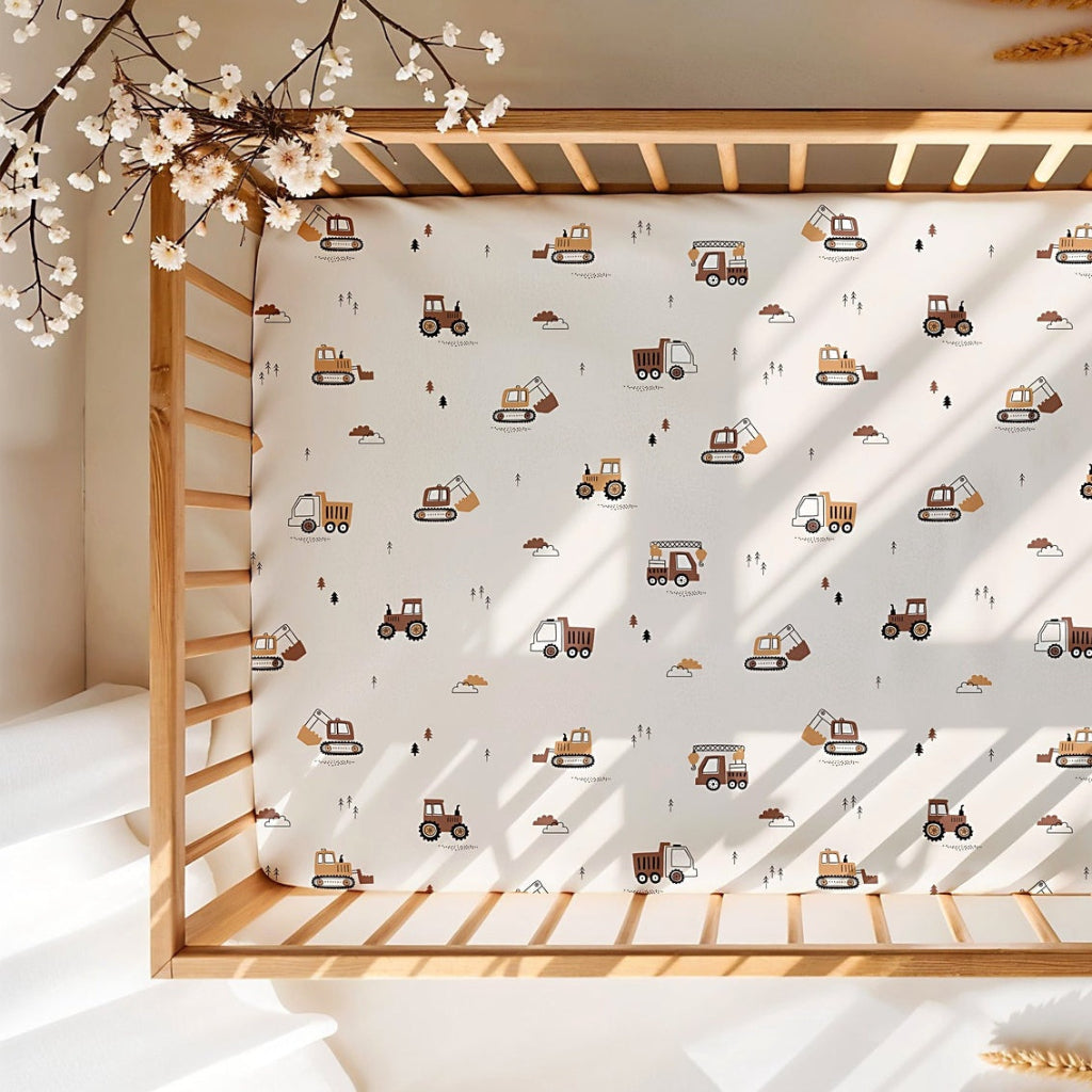 Neutral construction vehicle cot bed sheet with trucks, diggers and tractors