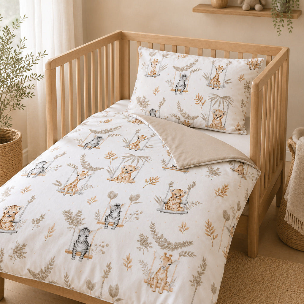 Neutral safari baby bedding set on wooden cot bed Uk Baby shop Fabricco