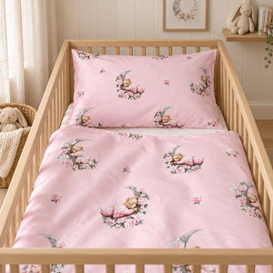Pink teddy bear cot duvet cover folded back to show the matching moon and floral print on both sides.