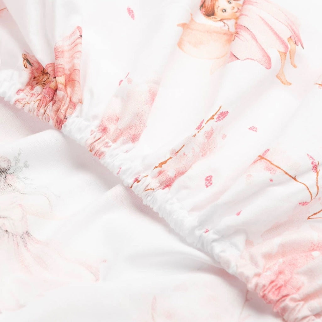  Pink Fairy Fitted Sheets, perfect for your little princess&#39;s cot or cot bed in various sizes. Crafted from pure cotton, it adds a whimsical touch to her baby pink nursery, featuring delightful fairies and blossoming flowers.