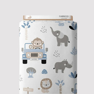 Safari Adventure blue cotton fabric by Fabricco UK with jungle animals and jeeps, ideal for nursery sewing and children’s projects.