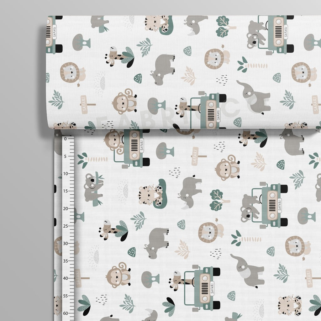 Safari Adventure sage green cotton fabric on a roll showing the horizontal jungle pattern. Fabricco UK