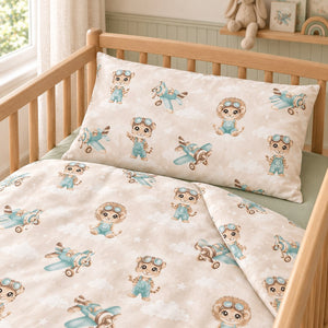 Close-up of Safari Pilot cotton pillowcase and folded duvet cover showing animal pilots, mint aeroplanes and matching print on both sides.