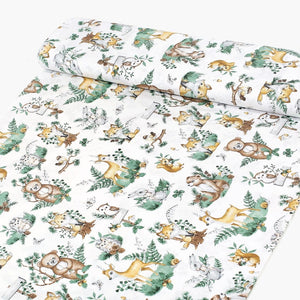 Sage green woodland animal cotton fabric on a roll from Fabricco UK, 160 cm wide, showing the horizontal fox and deer print.