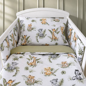 Cute Jungle Friends cot bedding set with cot wraps in a white cot, styled in a Scandinavian nursery with soft sage green wall panels